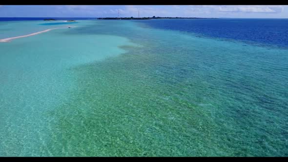 Aerial above travel of tropical bay beach holiday by clear lagoon with white sand background of a da