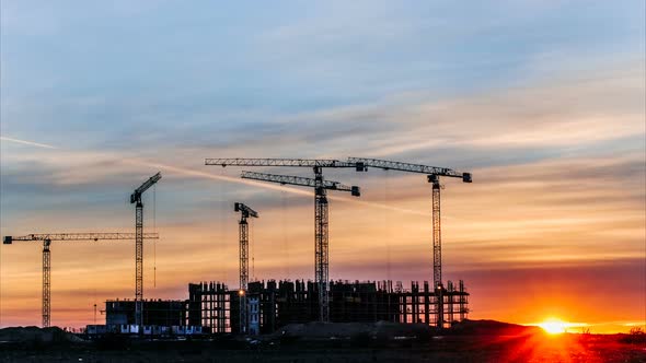 Construction Cranes Working at Sunset, Workers Engaged in Construction, Time Lapse