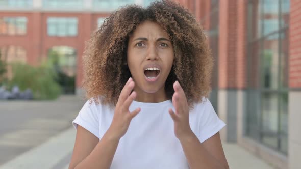 African Woman Reacting to Loss