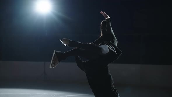 Professional Skaters in the Counterturns a Pair of Men and Women Perform a Rotation the Man Lifts