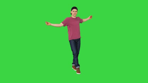 Hip-hop Guy in a Cap Dancing on a Green Screen