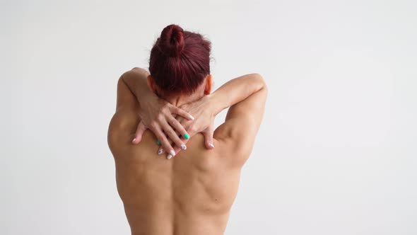 Naked Female Back with Perfect Figure Skin Moves Gracefully on White Background