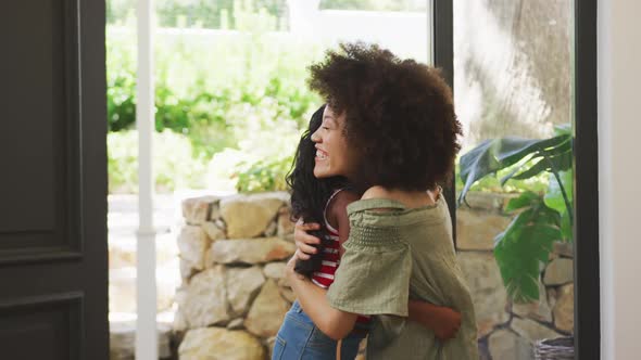 Mother and daughter hugging each other