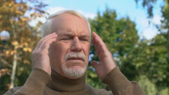 Elderly Gentleman Feeling Headache Tension Standing Outdoors, Health Weakness