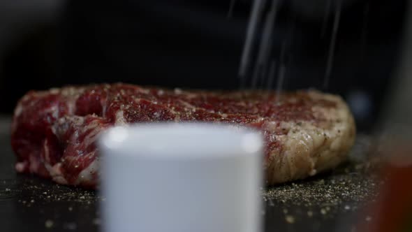 Adding Seasonings to Steak