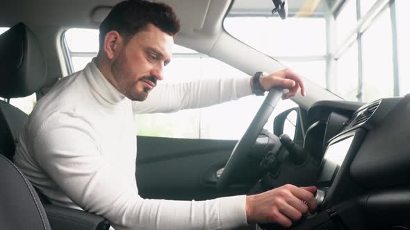 Stylish Man in a New Renault Use the Sensor at a Prestigious Auto Show