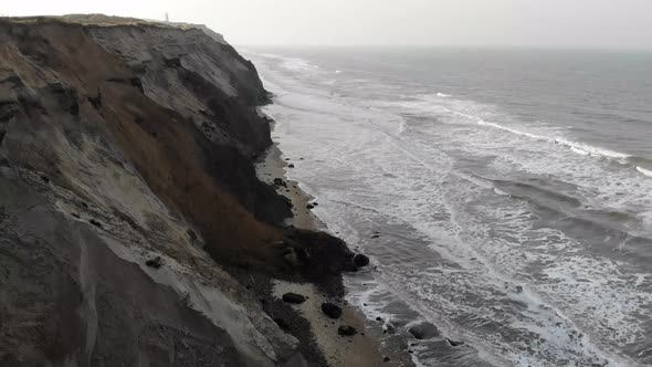 Aerial view of the Lighthouse and steep slopes at Rubjerg Knude by the North Sea, Denmark