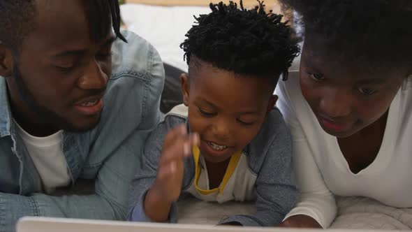 Family using laptop together at home