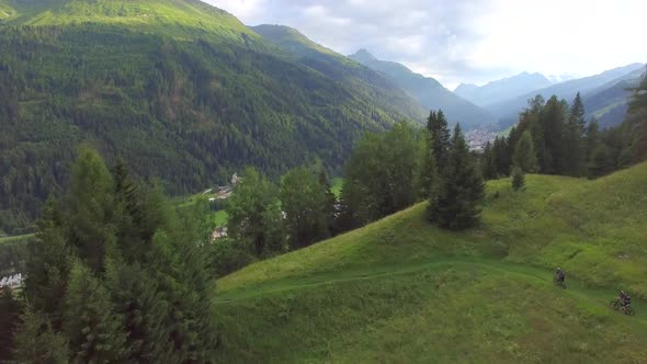 Aerial view of mountain bikers on a scenic singletrack trail