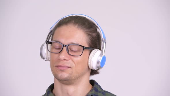 Face of Handsome Hipster Man Listening To Music