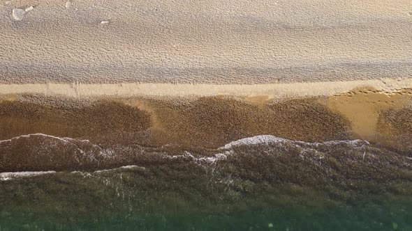 Aerial View From Above on Azure Sea and Pebbles Beach