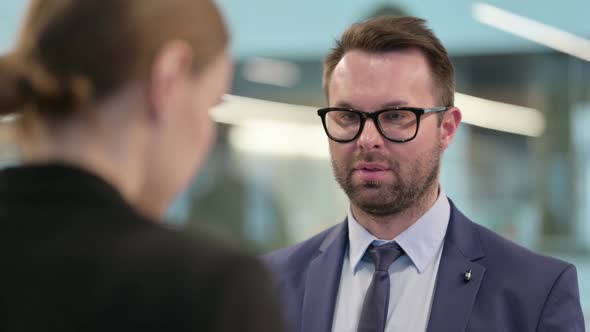 Angry Businessman Fighting with Businesswoman