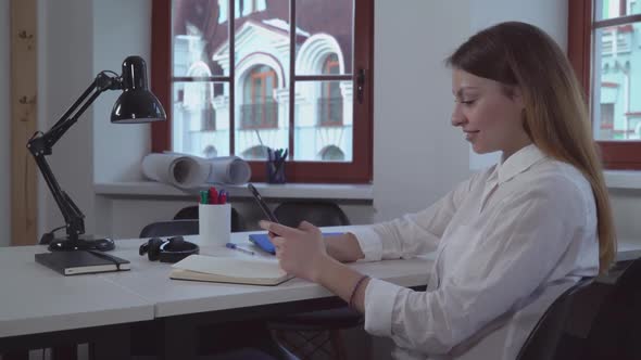 Woman Using Smartphone the Working Place