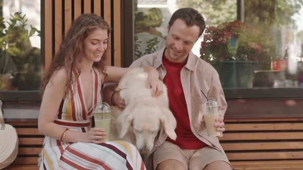 Couple with Dog in Outdoor Cafe