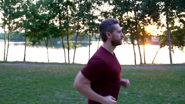 Healthy Mature Man in Sportswear Running at River Outdoor Healthy Life