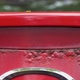 Pan of bubbled-up rust on a red car's tail light - VideoHive Item for Sale