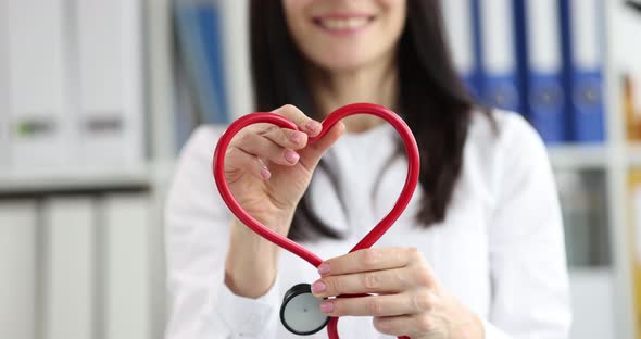 Doctor Cardiologist Makes Stethoscope Heart Sign Closeup