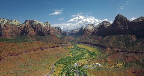 Drone moves away from the canyon settlement (Zion National Park, Utah, USA)