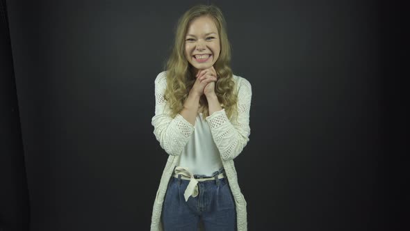 Lady with Curly Fair Hair Performs Emotions of Happiness