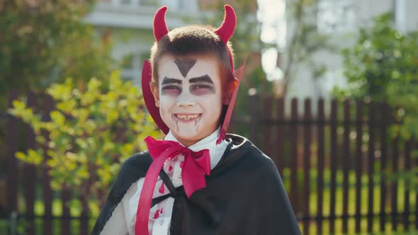 Boy in Halloween Costume Smiling for Camera