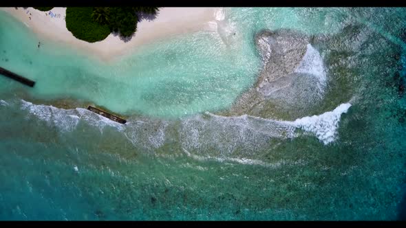 Aerial drone shot abstract of tranquil shore beach time by shallow ocean with white sand background 