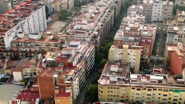 Aerial drone view of Barcelona, Spain. Blocks with multiple residential buildings, road with cars