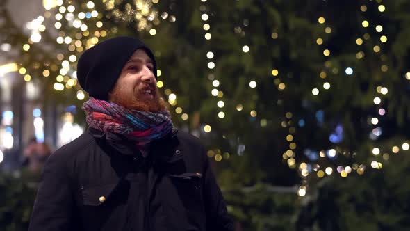 Handsome Cheerful Young Caucasian Red Bearded Man in Festive Christmas Mood