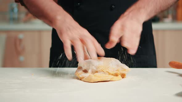 Caucasian Man Shaping a Bread Loaf