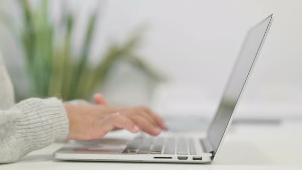 Close Up of Hands of African Woman Typing on Laptop