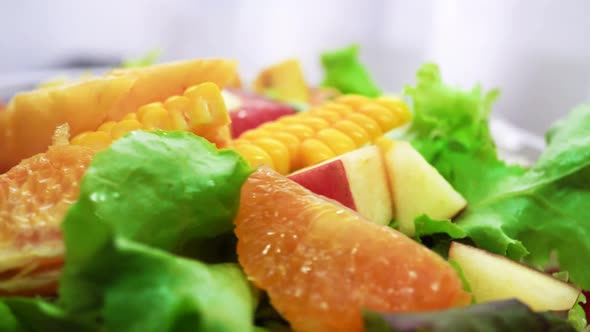 Organic Green Salad with Various Kinds of Fruits in Rotating Macro Shot  Healthy Life