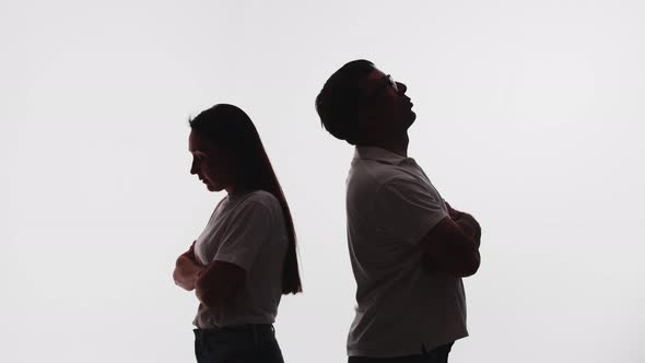 Silhouette of Husband and Wife They Stand with Their Backs to Each Other Talk About Their Problems