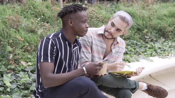 Young Diverse Friends Eating Takeaway Food Outdoor