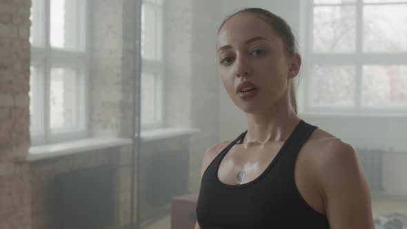 Portrait Of Female Kickboxer In Combat Stance