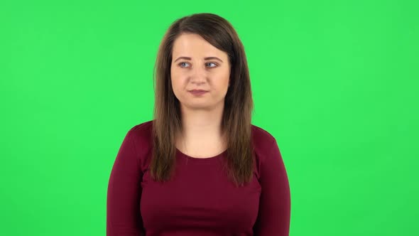 Portrait of Pretty Girl Worrying in Expectation Then Smiles and Sighs with Relief. Green Screen