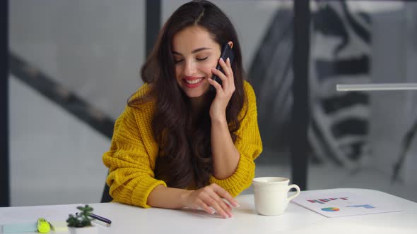Closeup Smiling Businesswoman Talking Mobile Phone in Office