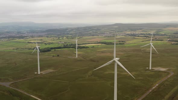 Aerial views over English moorland and wind turbines