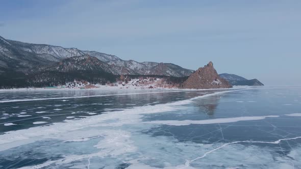 Aerial View of Man Skating on Lake Baikal Covered By Ice