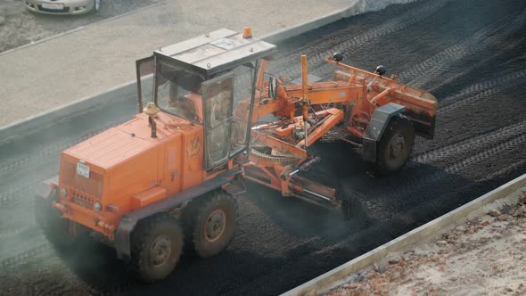 Road works with an asphalt paver. Special road equipment