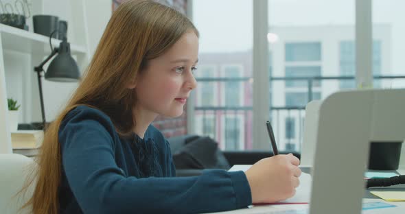 Adorable Schoolgirl Studying Remote Online From Home