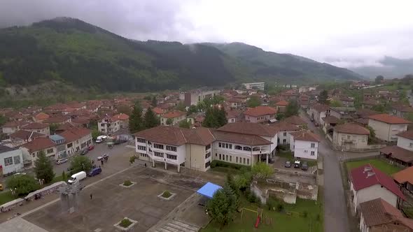 City landscape and green area beside the mountain