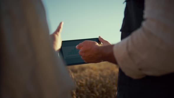 Farmer Hands Holding Pad Computer Closeup