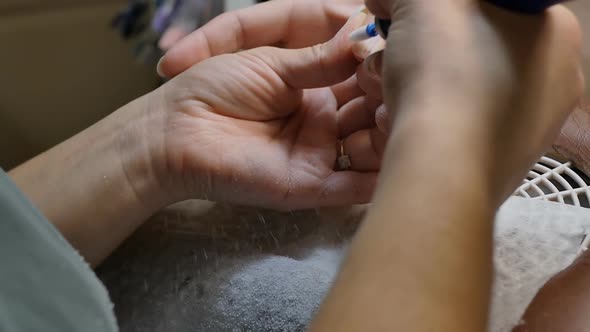 Removing Old Gel Polish Shellac From the Nail with a Manicure Machine