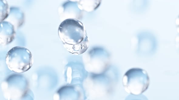 Super Slow Motion Shot of Hydrogel Balls Bouncing on Glass at 1000Fps