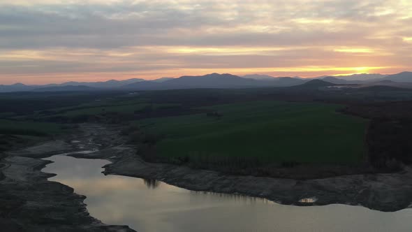 Aerial View Of Half Empty Reservoir