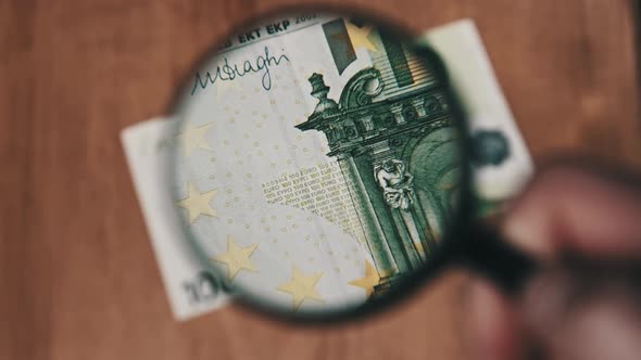 One Hundred Euro Under Magnifying Glass