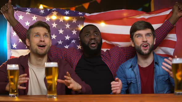 American Multiethnic Male Fans Celebrating Favorite Team Victory, Waving Flag