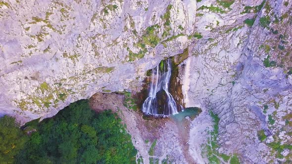 Waterfall Gega - Flows From the Rock. Summer, Green Trees , Cascade. Shooting From a Drone