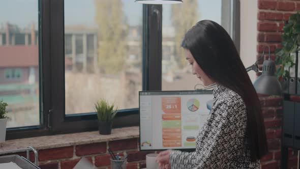 Close Up of Business Woman Analyzing Financial Documents