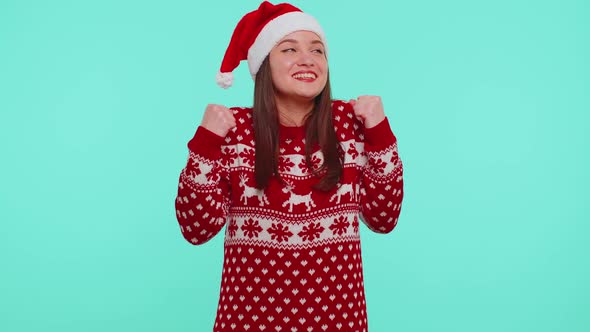 Cheerful Girl in Red Sweater Christmas Santa Shouting Celebrating Success Winning Goal Achievemen