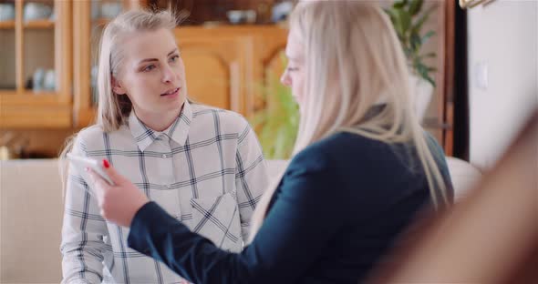 Businesswomen Discussing Business Ideas In Office